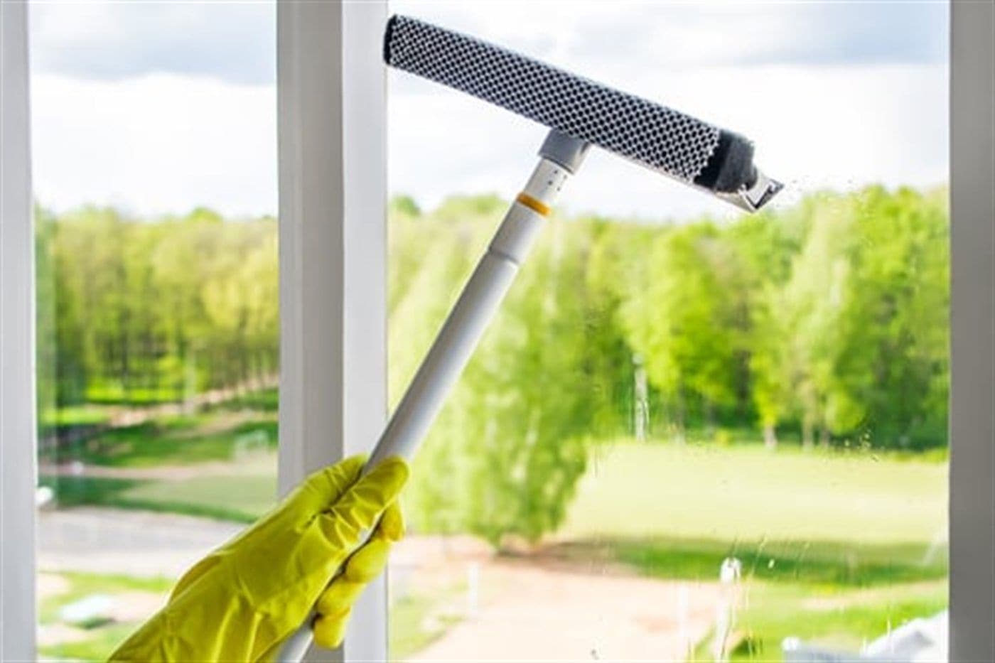 Steam cleaning wand lifting soil from a Long Island living room carpet
